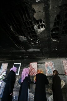 Gaza artist exhibits on war-scorched walls