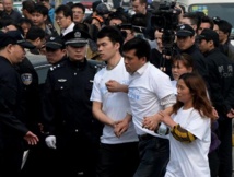 Vol MH370: recherches suspendues pour cause de météo, manifestation à Pékin Vol MH370: recherches suspendues pour cause de météo, manifestation à Pékin